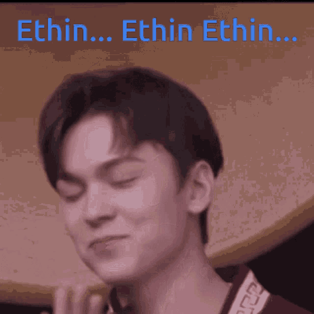 a close up of a young man 's face with the words ethin ... ethin ethin ... written above him .