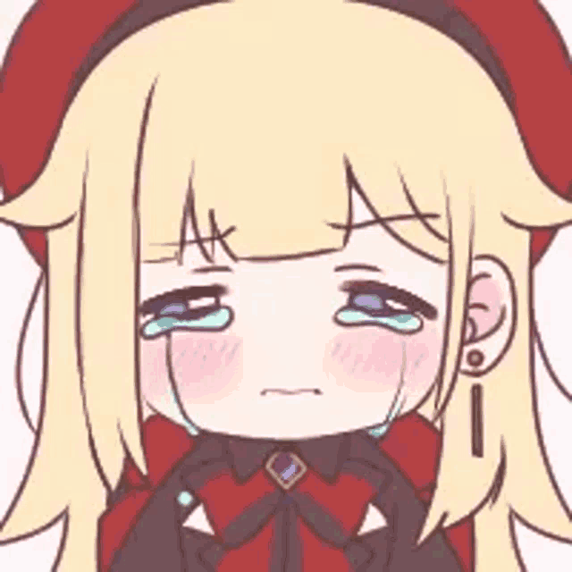 a cartoon girl is crying and wearing a red hat and earrings .