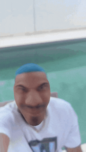 a blurry picture of a man with a blue headband on his head