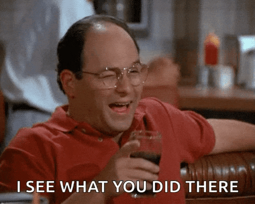 a bald man with glasses is laughing while holding a glass of wine and saying i see what you did there .