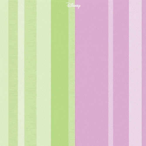 a woman in a suit with a pearl necklace is standing in front of a pink and green striped wall ..