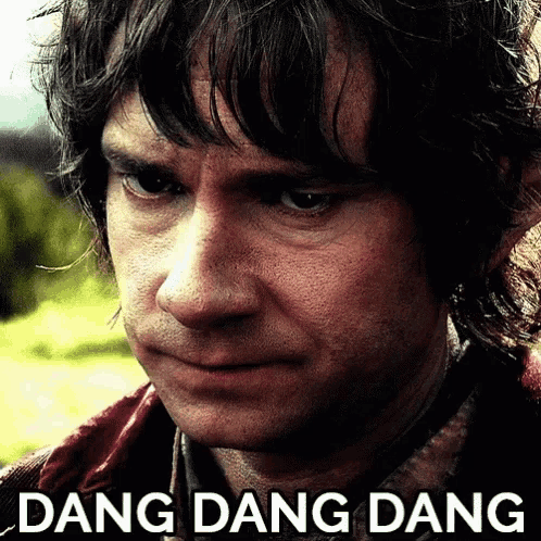 a close up of a man 's face with the words " dang dang dang " below him