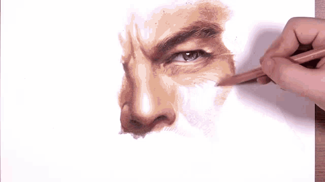 a person is drawing a man 's face with a marker