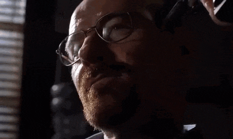 a man with glasses is talking on a cell phone and saying everybody wins .
