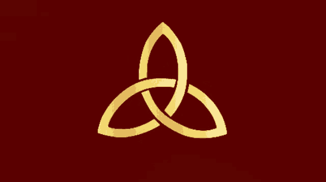 a gold symbol on a red background that looks like a leaf