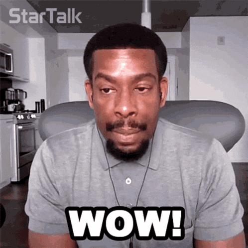 a man with a beard says wow on a screen