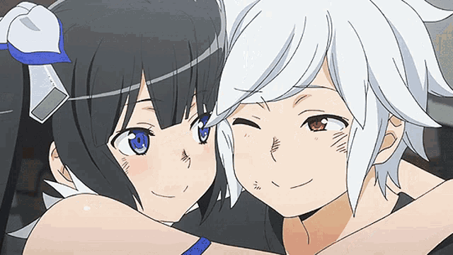 a boy and a girl are hugging each other and looking at the camera