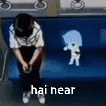 a man is sitting on a blue couch with the words hai near written on the bottom
