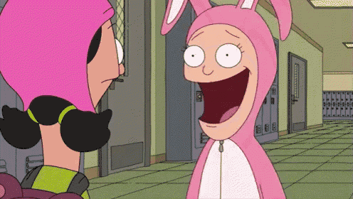 a cartoon character in a pink bunny costume is laughing