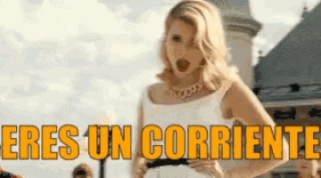 a woman in a white dress is standing in front of a building and the words eres un corriente are above her