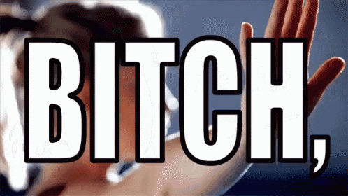 a woman 's hand is reaching towards the word bitch