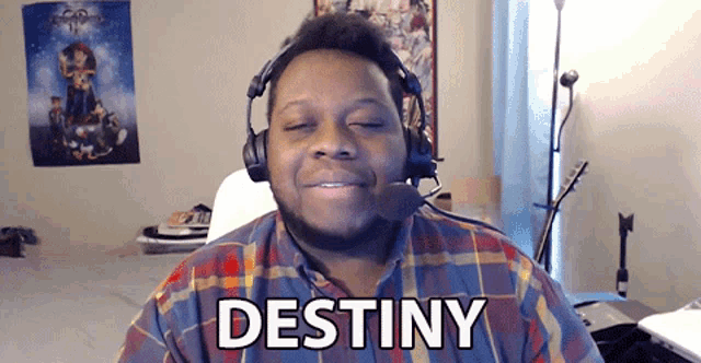 a man wearing headphones has the word destiny written on his face