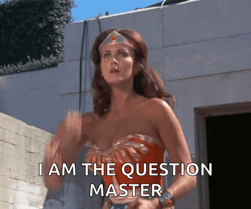 wonder woman says i am the question master in front of a building