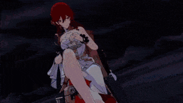 a woman with red hair is standing in front of a pink sky .