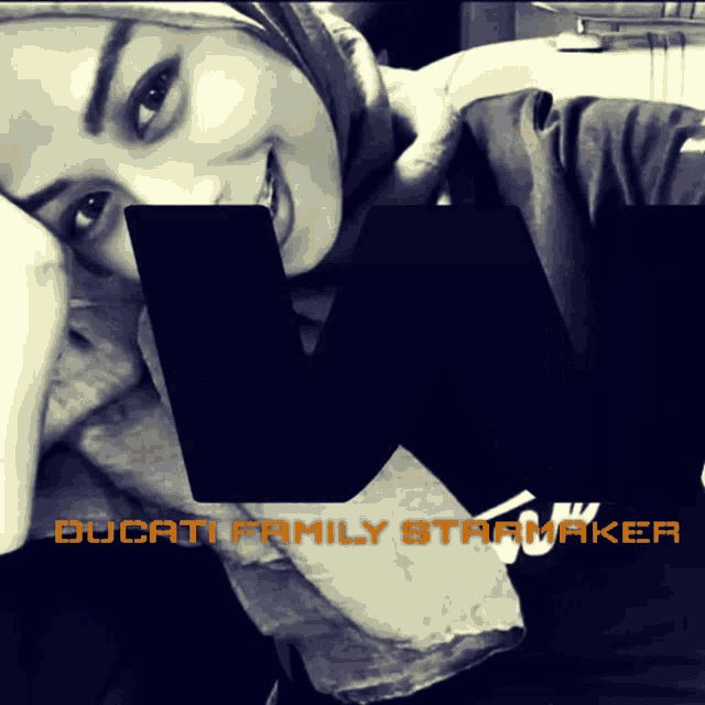 a black and white photo of a woman with ducati family starmaker written on the bottom