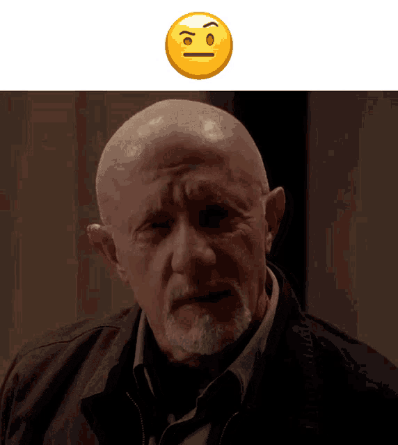 a bald man with a beard has a smiley face above his head that says i 'm sorry