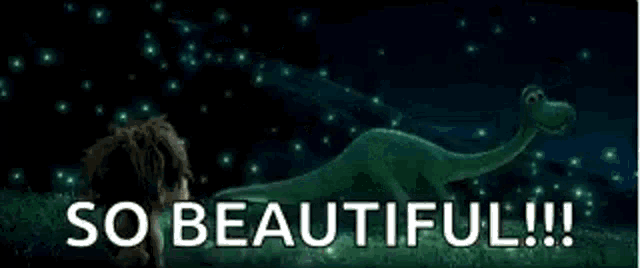 a boy is peeking out of the grass at night with fireflies flying in the background .