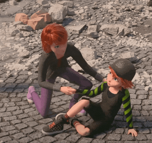 a woman kneeling down to help a boy who is laying on the ground