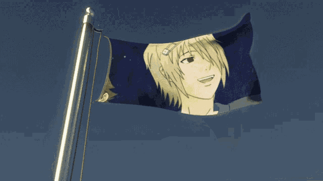 a flag with a picture of a boy on it is flying in the wind