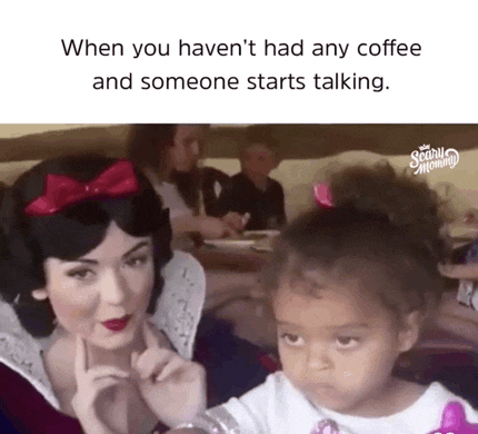 a little girl is sitting next to a woman in a snow white costume