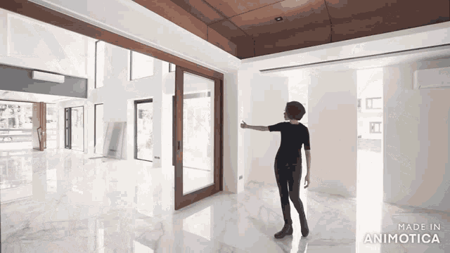 a woman standing in an empty room with the words made in animatica on the bottom right