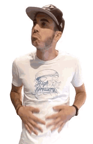 a man wearing a hat and a white shirt that says high gressery