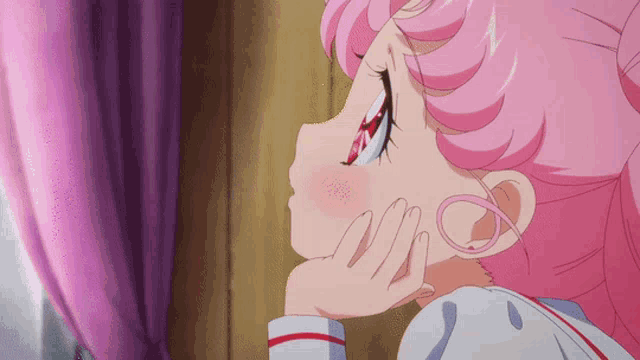 a little girl with pink hair is looking out a window