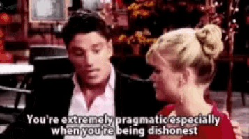a man and a woman are sitting next to each other in a restaurant and the woman is talking to the man .
