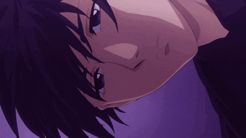 a close up of a person 's face with purple eyes