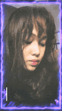 a girl 's face is surrounded by a purple and blue lightning frame