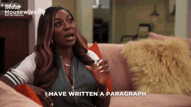 a woman sitting on a couch with the words i have written a paragraph behind her