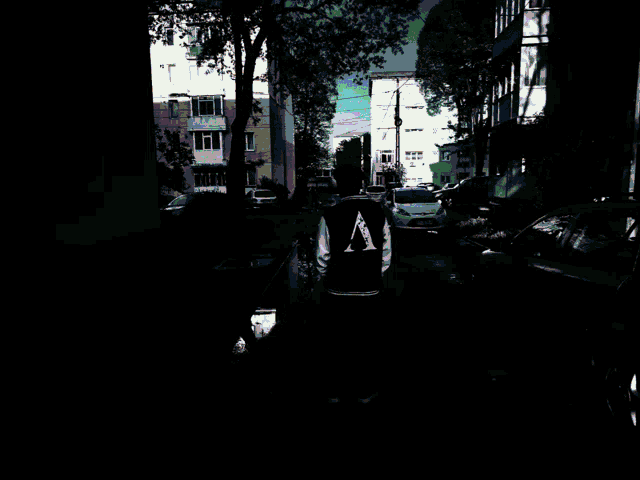 a blurry picture of a city street with a rainbow of lights