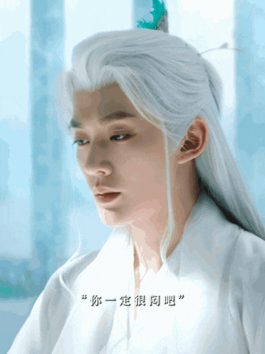 a man with long white hair and a feather on his head