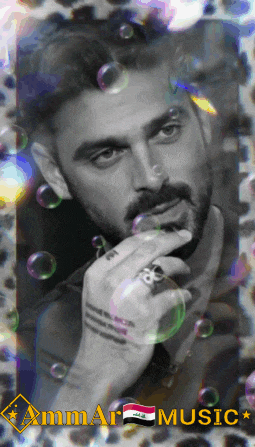 a black and white photo of a man with bubbles around him and the words ammar music below him