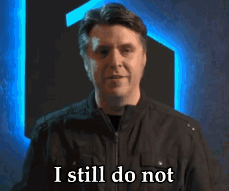 a man in a black jacket says human sexuality in front of a blue light