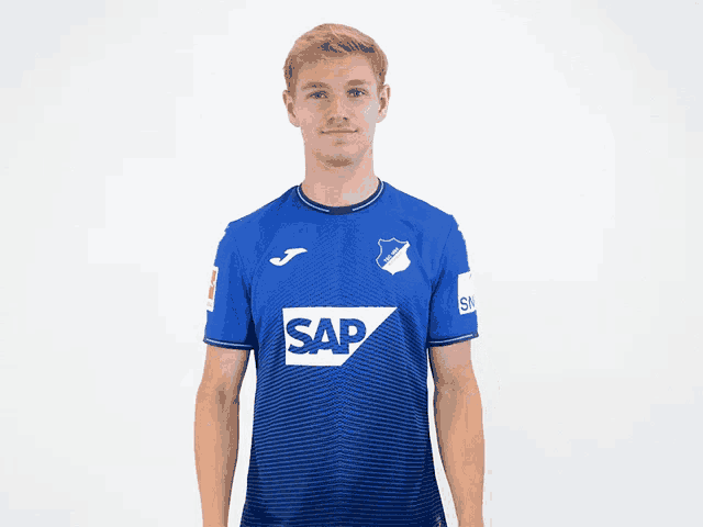 a man wearing a blue shirt that says sap