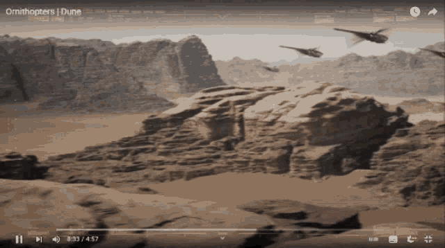 a video of a desert scene with the words " omithopters dune " on the bottom
