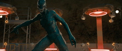 a superhero with a lot of tentacles is standing in a room