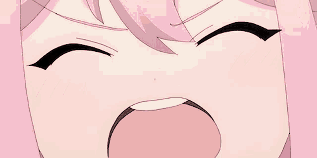 a close up of a girl with pink hair making a funny face
