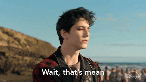 a young man says wait that 's mean in front of a crowd