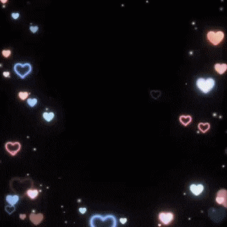 a doll is surrounded by hearts and sparkles on a dark background