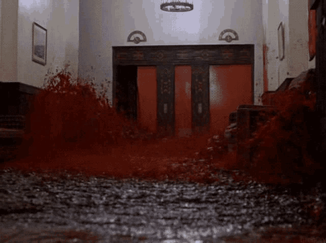 a hallway with a lot of blood coming out of the floor