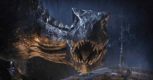 a close up of a dinosaur 's mouth in the rain