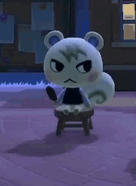 a stuffed animal is sitting on a stool in a video game and holding a knife .