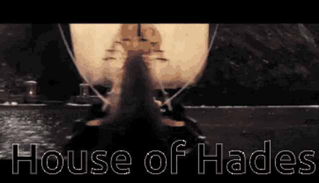 a picture of a boat in the water with the words house of hades below it