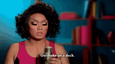a woman in a pink tank top drinks through a straw and says go choke on a duck