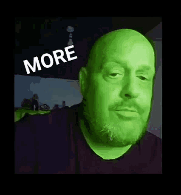 a man with a green face has the word more written on his face