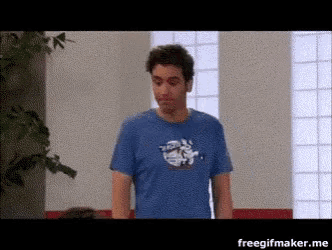 a man in a blue shirt is standing in front of a window with the words freegifmaker.me below him