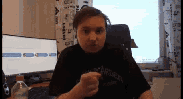 a man wearing a black shirt that says bacardien