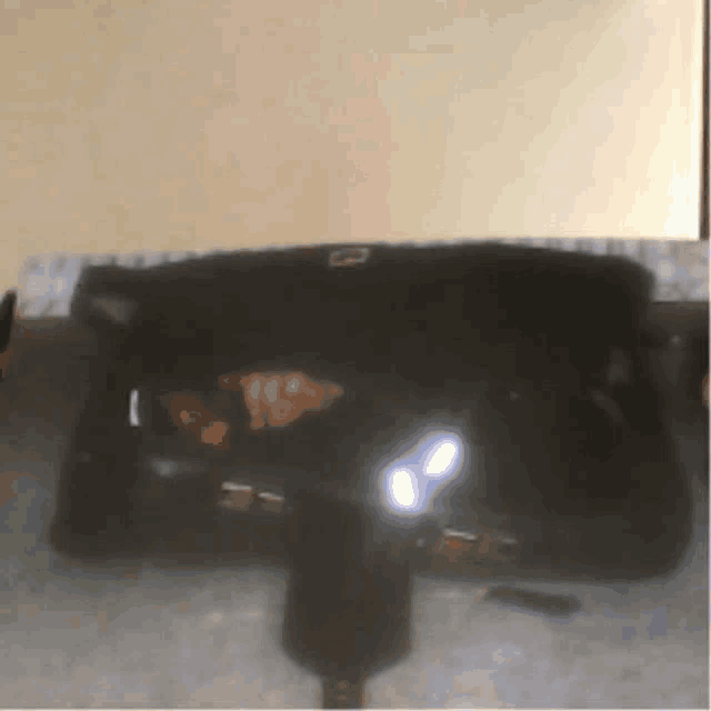 a black item with a letter b on it